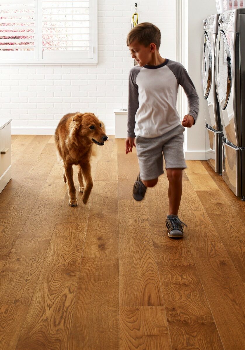 Kid running with dog